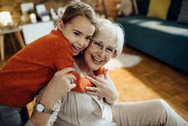 Two women laughing together.